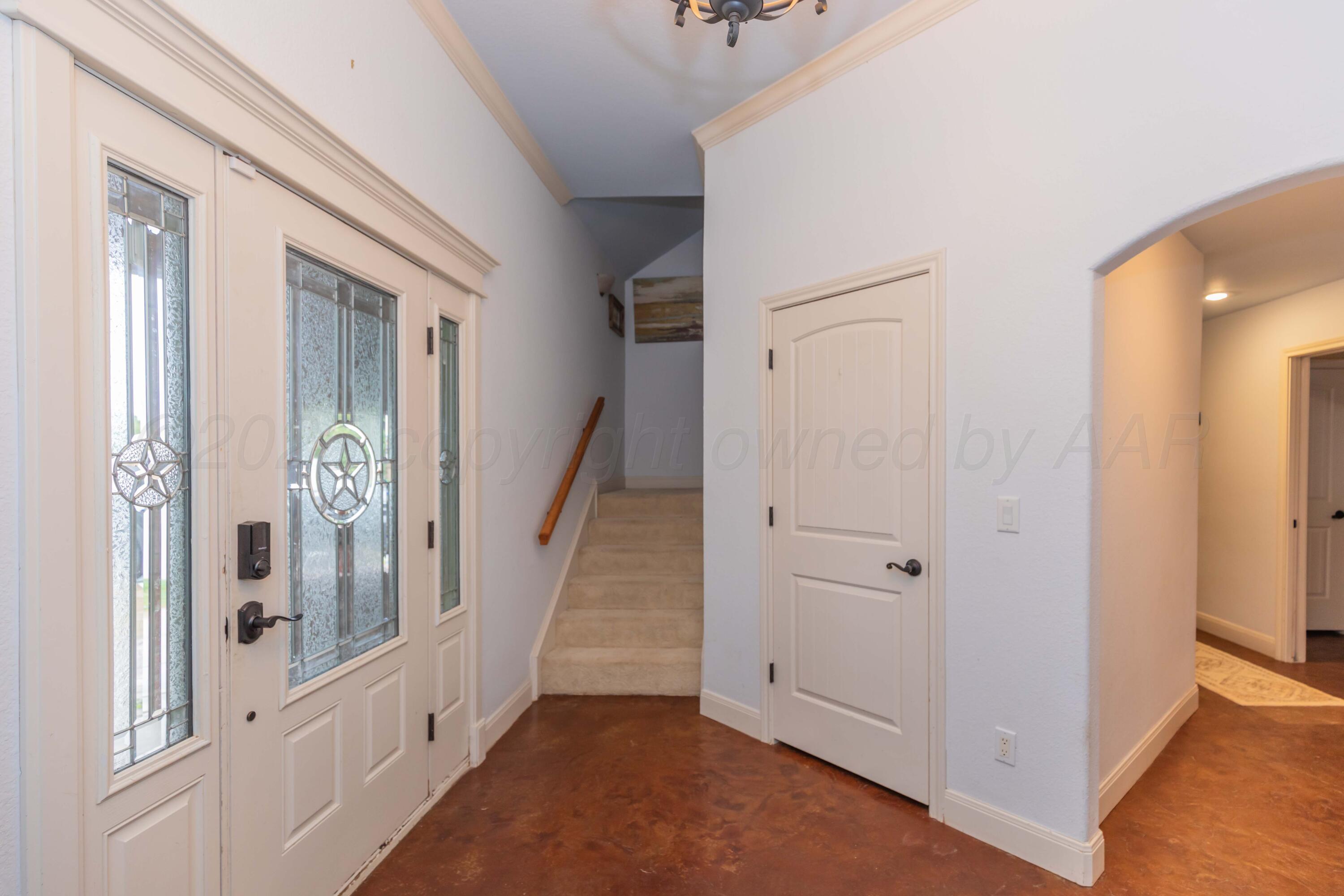 1301 Moon Ridge Lane Amarillo, TX 79124 - Photo 5 of 34 wooden floor with white walls and windows