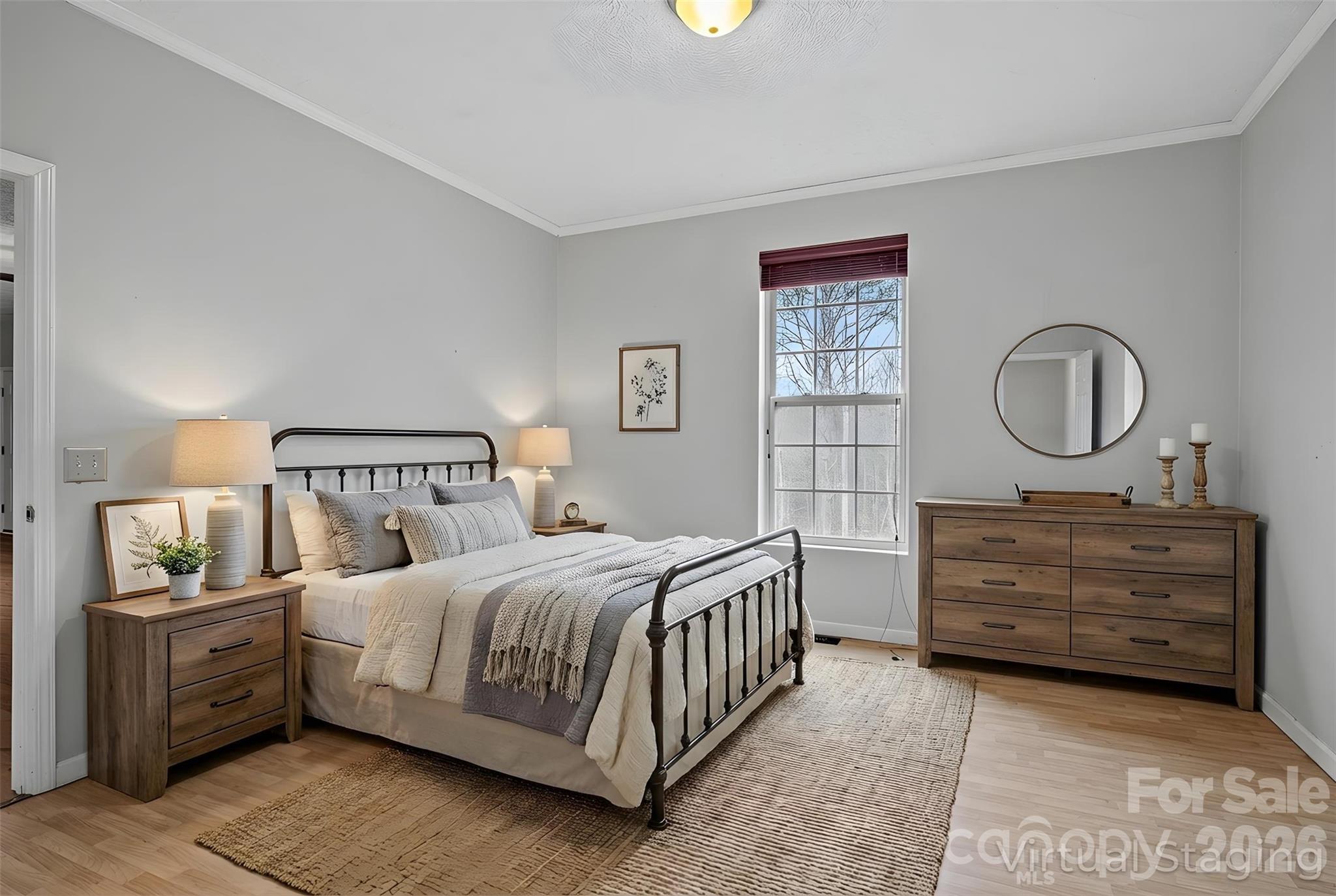 60 Maple Ridge Drive Old Fort, NC 28762 - Photo 13 of 42 a bedroom with a bed a mirror and dresser