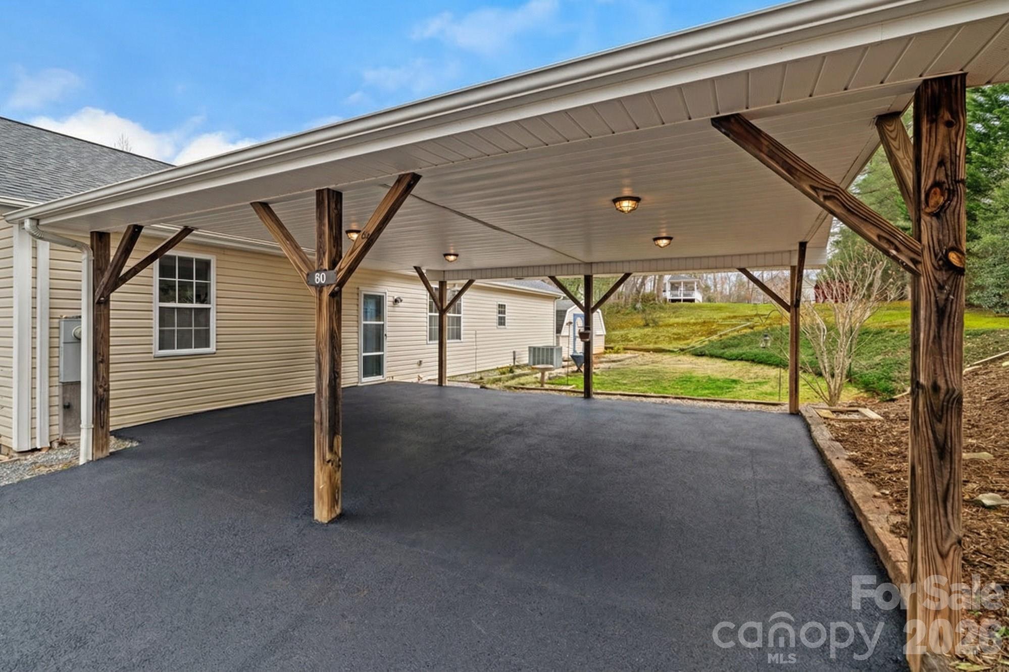 60 Maple Ridge Drive Old Fort, NC 28762 - Photo 2 of 42 a view of garage and deck
