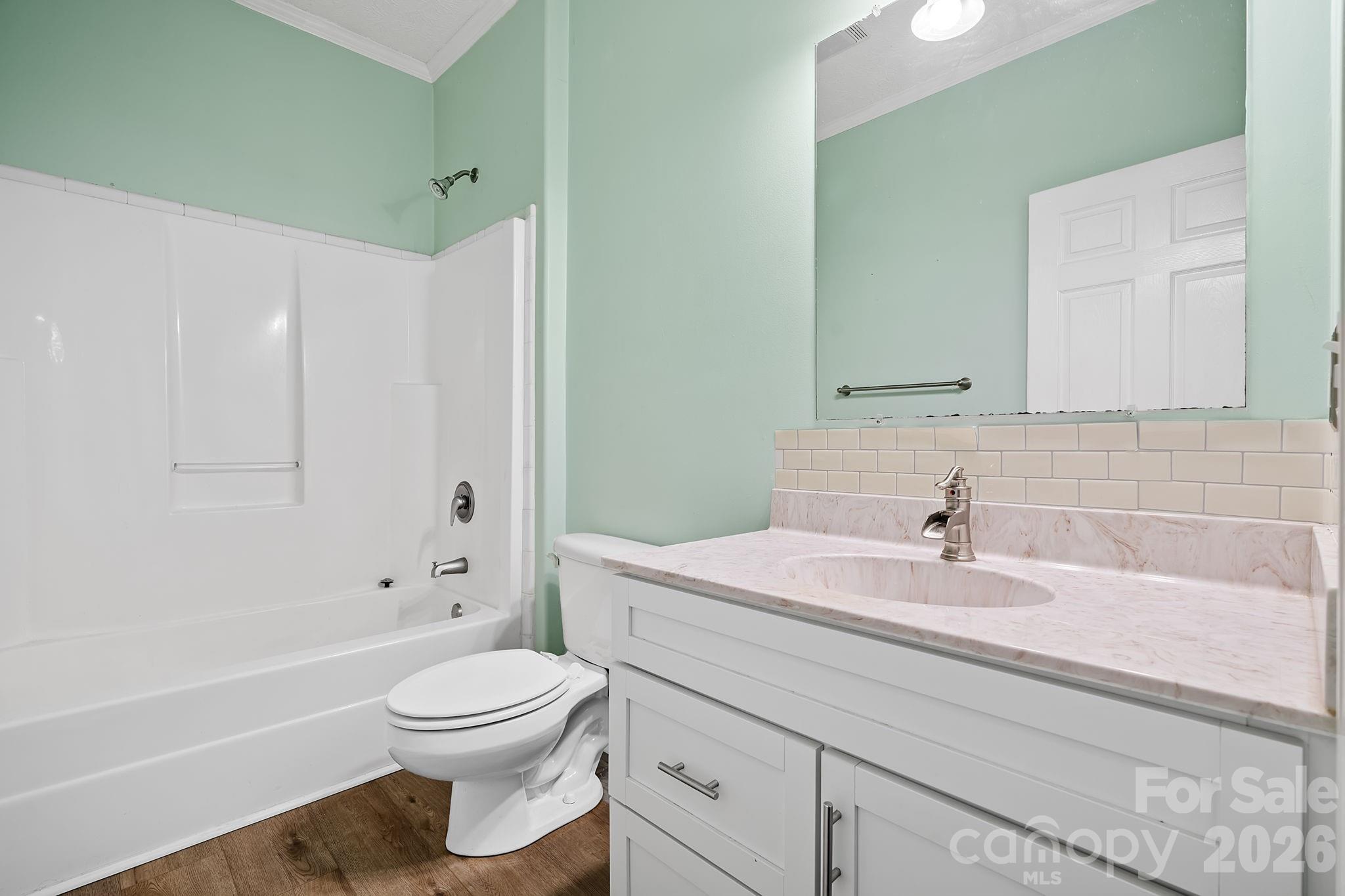 60 Maple Ridge Drive Old Fort, NC 28762 - Photo 21 of 42 a bathroom with a sink a toilet and a bathtub