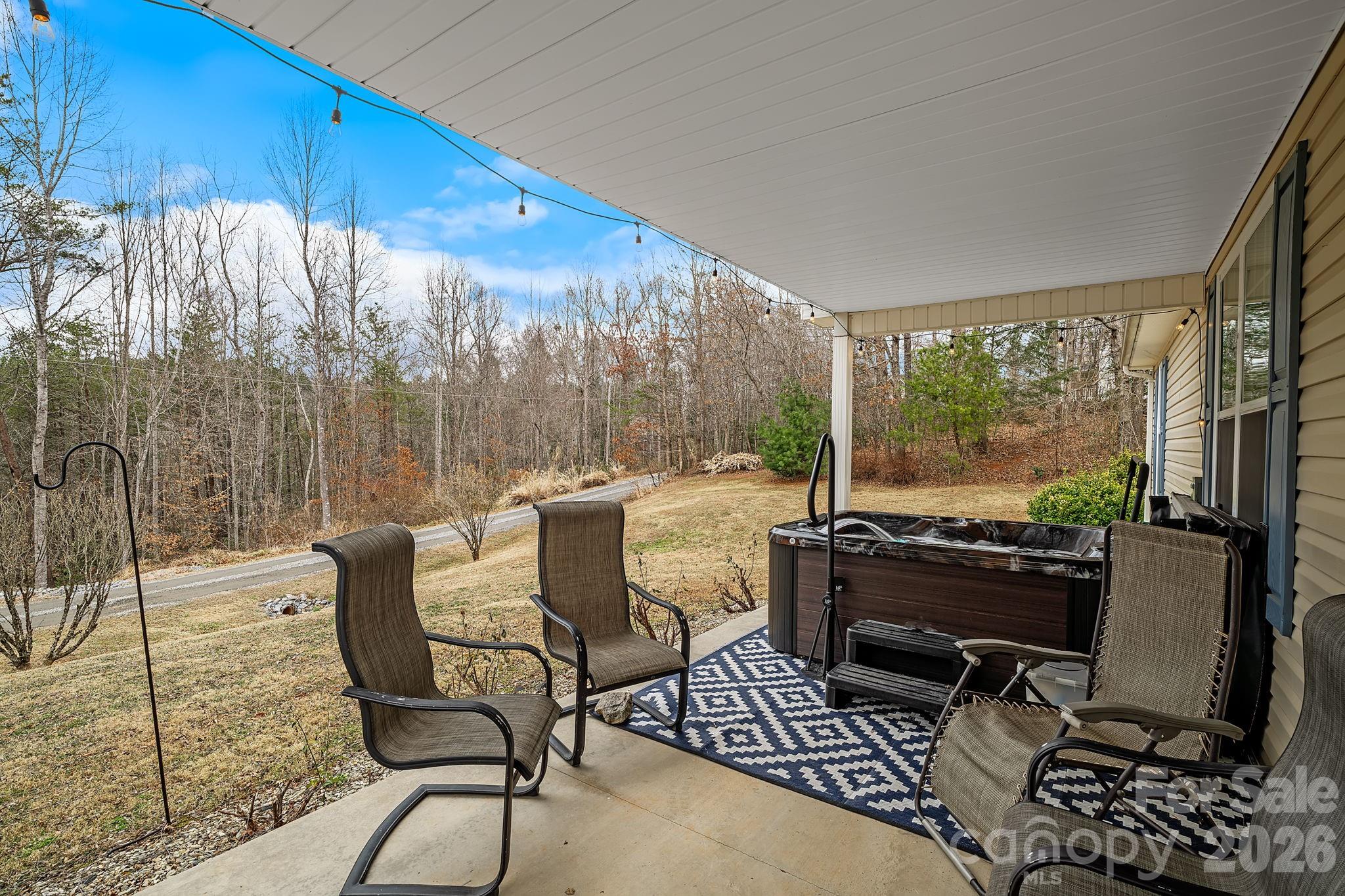 60 Maple Ridge Drive Old Fort, NC 28762 - Photo 26 of 42 a living room with furniture and a floor to ceiling window