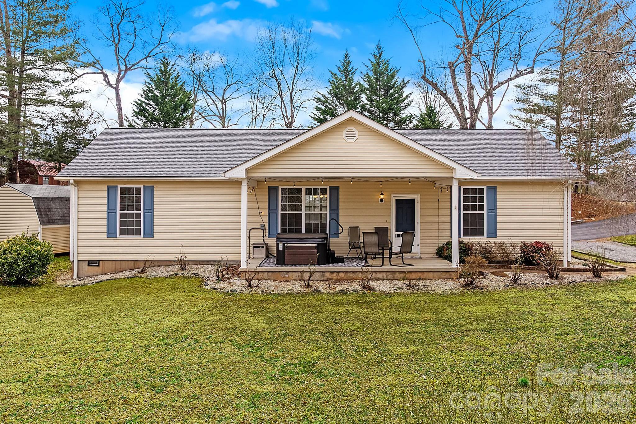 60 Maple Ridge Drive Old Fort, NC 28762 - Photo 3 of 42 a front view of house with yard and outdoor seating