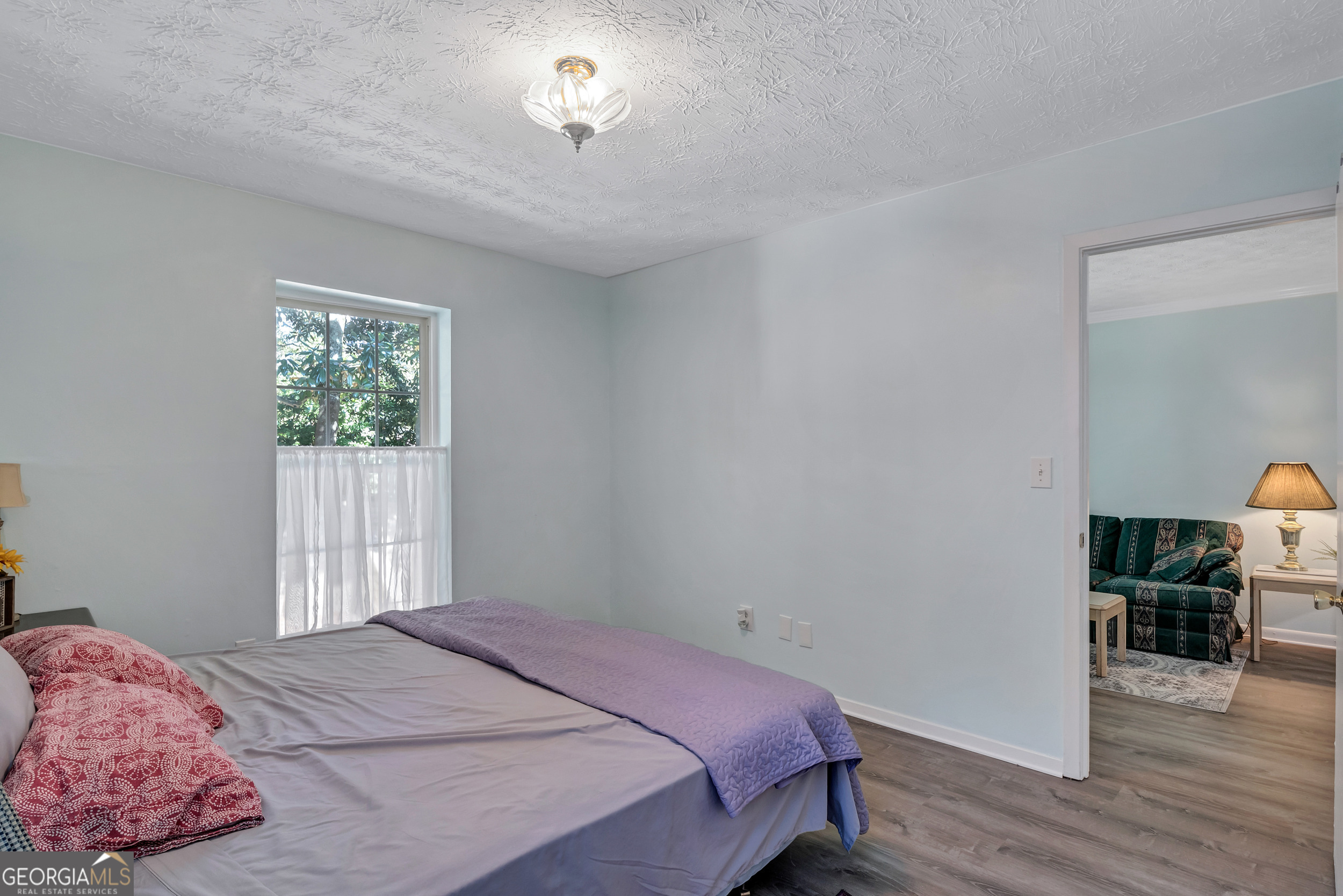 2805 Northeast Expressway Northeast, Unit C12 Atlanta, GA 30345 - Photo 17 of 21 a bedroom with a bed and a window