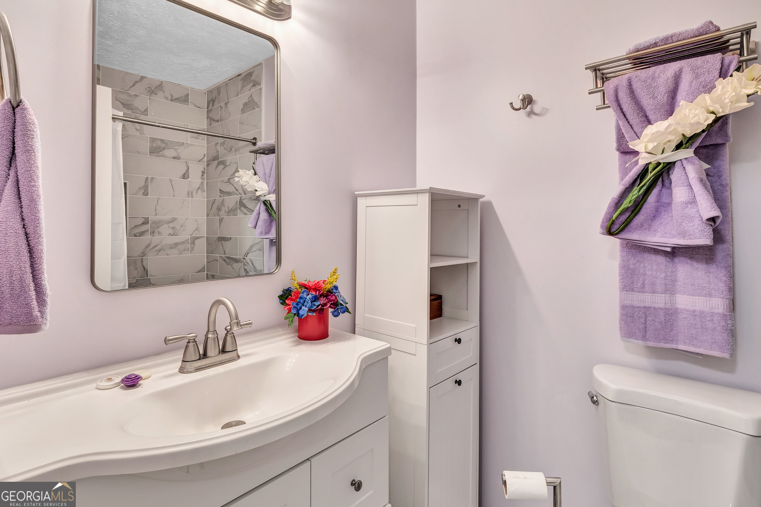 2805 Northeast Expressway Northeast, Unit C12 Atlanta, GA 30345 - Photo 19 of 21 a bathroom with a sink and a mirror