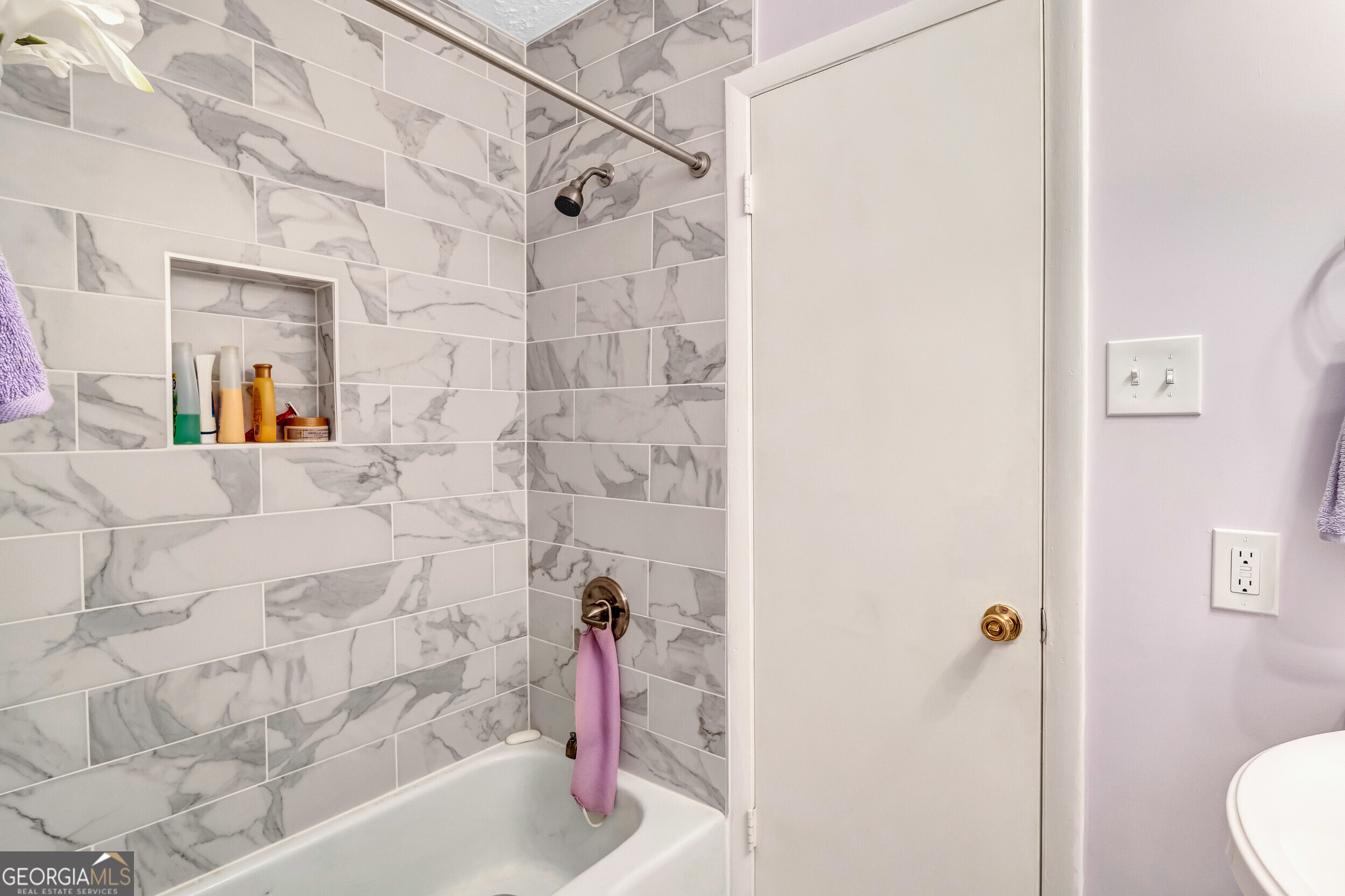 2805 Northeast Expressway Northeast, Unit C12 Atlanta, GA 30345 - Photo 20 of 21 a bathroom with a bathtub and a shower