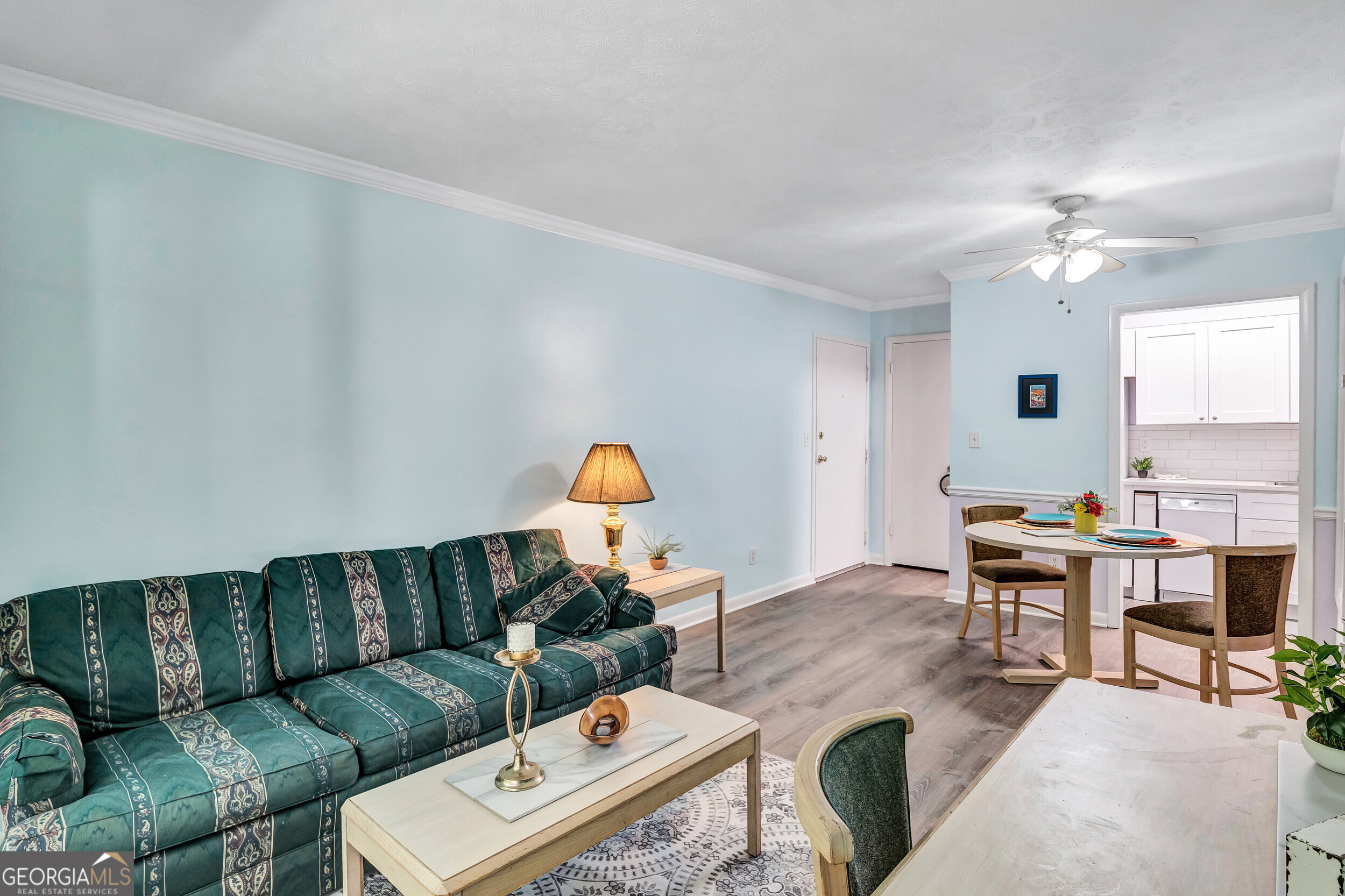 2805 Northeast Expressway Northeast, Unit C12 Atlanta, GA 30345 - Photo 5 of 21 a living room with furniture and a chandelier