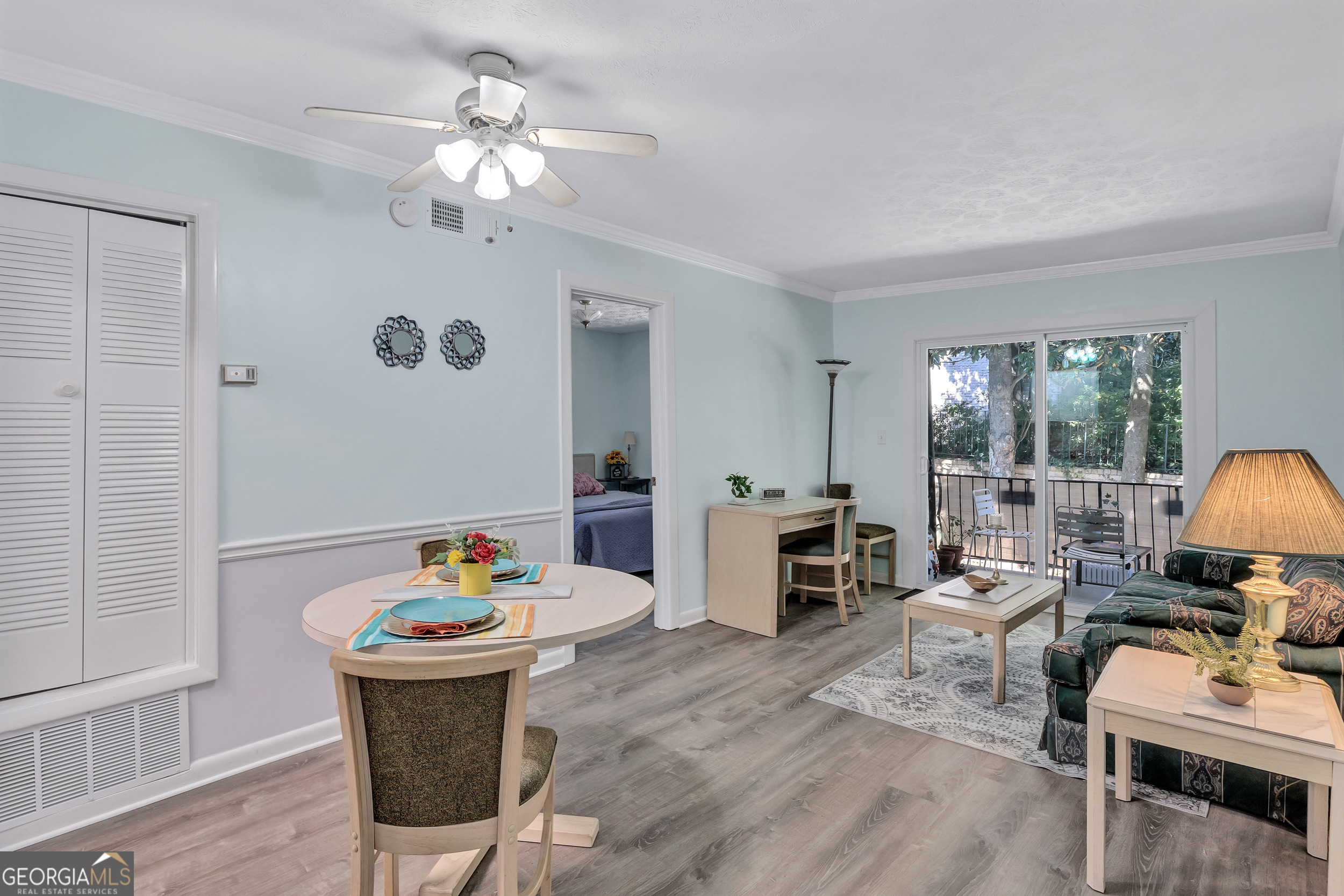 2805 Northeast Expressway Northeast, Unit C12 Atlanta, GA 30345 - Photo 8 of 21 a living room with furniture and a chandelier