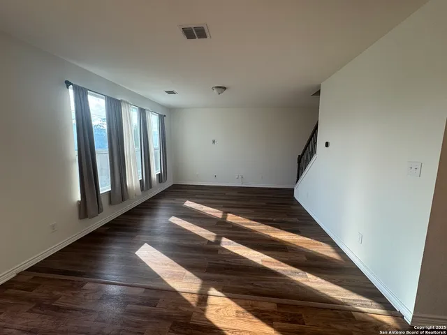 a view of a living room and a wooden floor