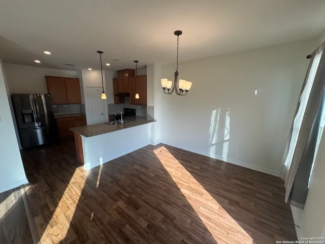 a kitchen with refrigerator and countertop