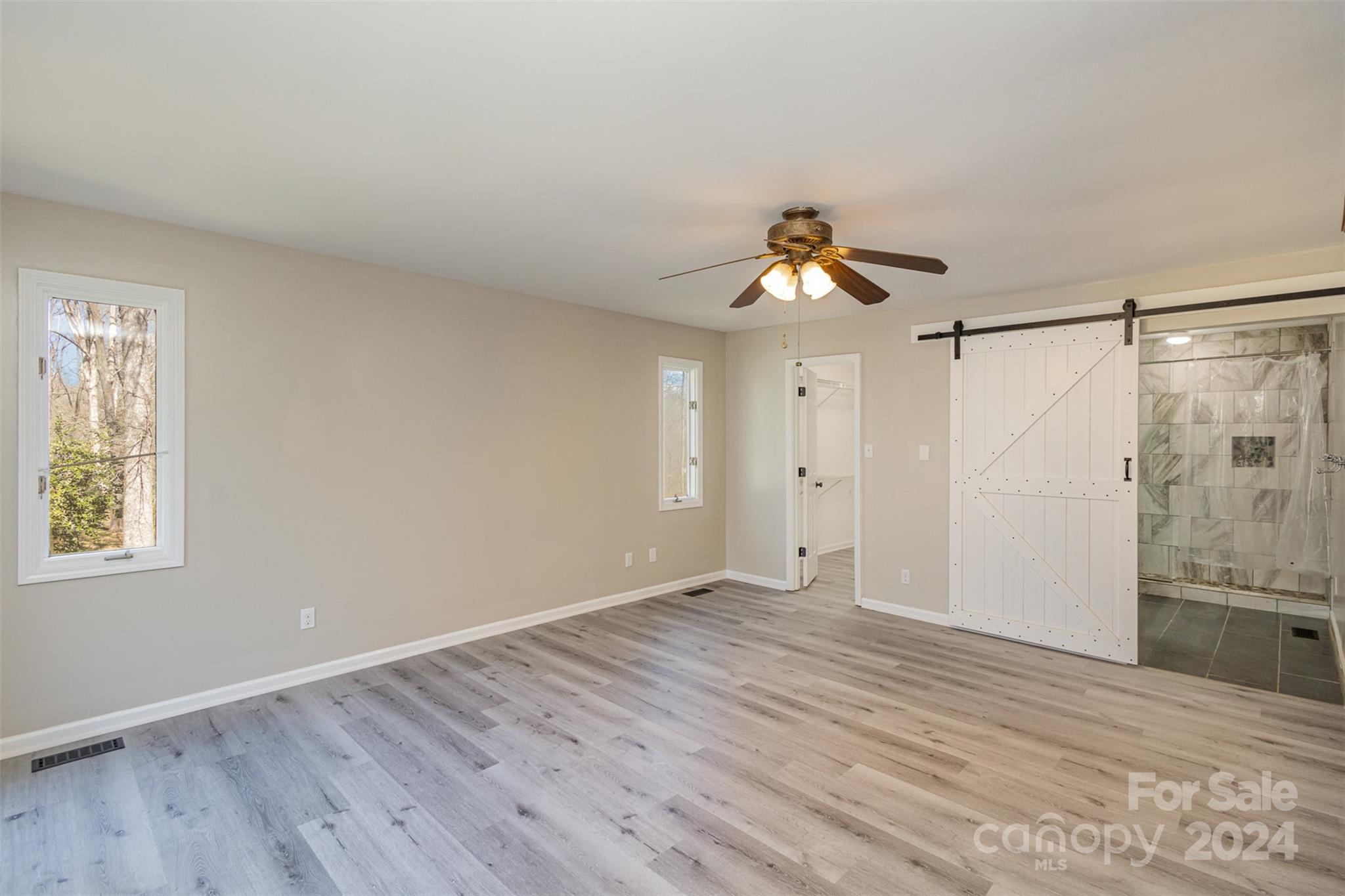1704 Double Oaks Road Fort Mill, SC 29715 - Photo 19 of 48 a view of an empty room with a window