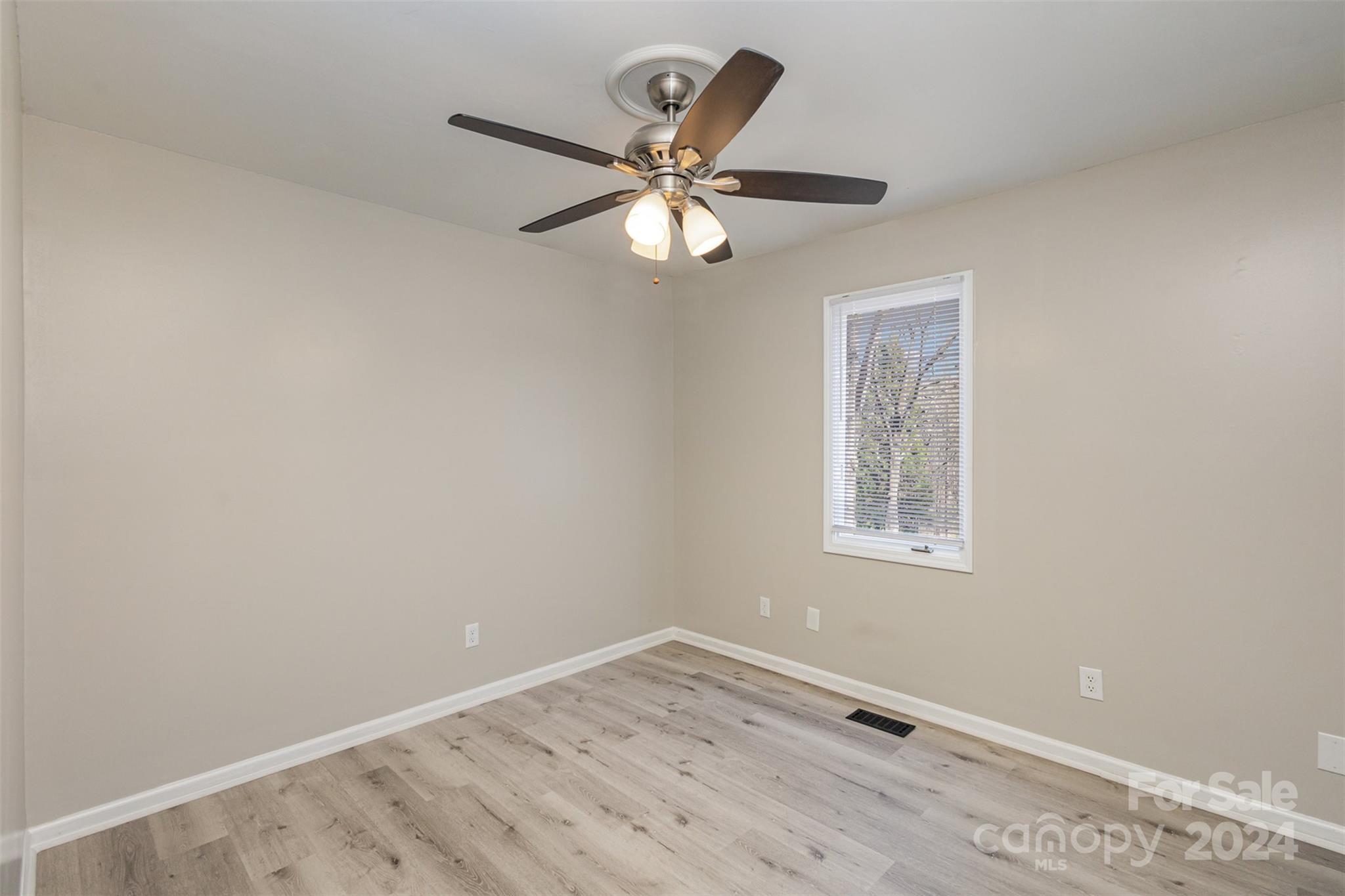1704 Double Oaks Road Fort Mill, SC 29715 - Photo 26 of 48 a view of an empty room with a window