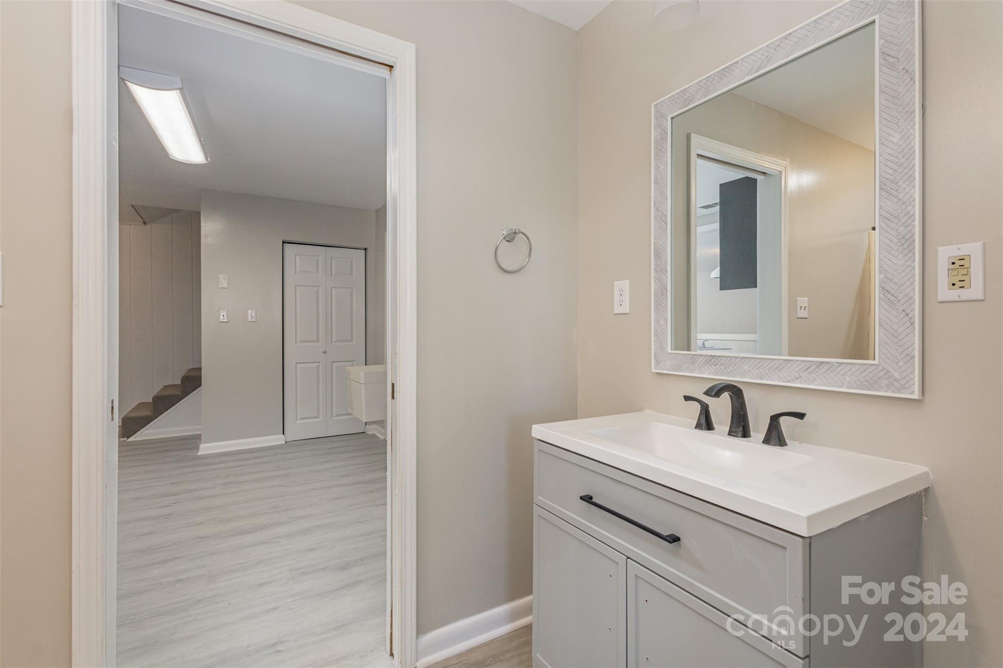 1704 Double Oaks Road Fort Mill, SC 29715 - Photo 32 of 48 a bathroom with a sink and a mirror
