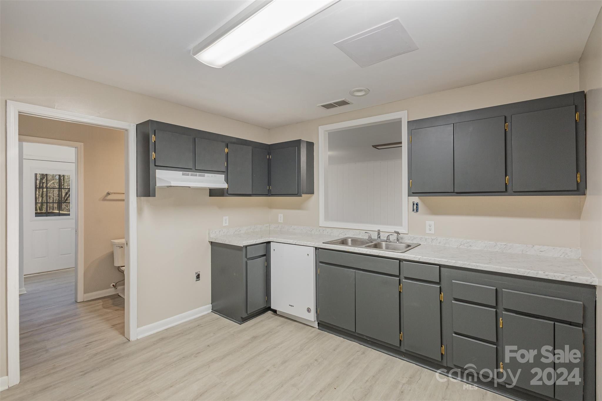 1704 Double Oaks Road Fort Mill, SC 29715 - Photo 33 of 48 a kitchen with a sink and cabinets