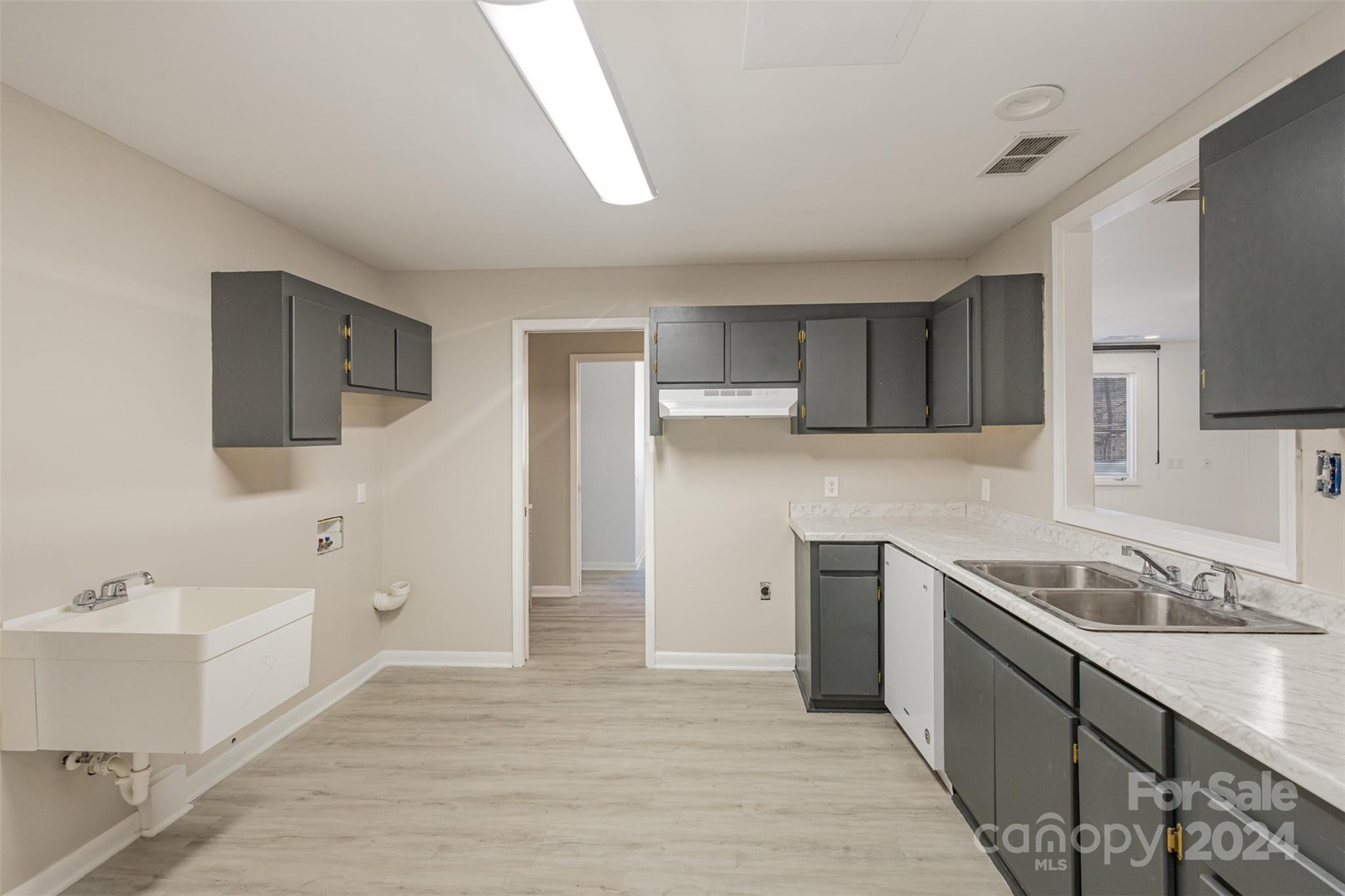 1704 Double Oaks Road Fort Mill, SC 29715 - Photo 34 of 48 a kitchen with a sink stove and refrigerator