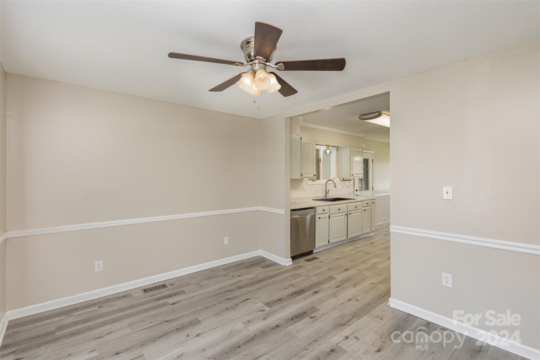1704 Double Oaks Road Fort Mill, SC 29715 - Photo 5 of 48 a view of a kitchen with a sink and a refrigerator