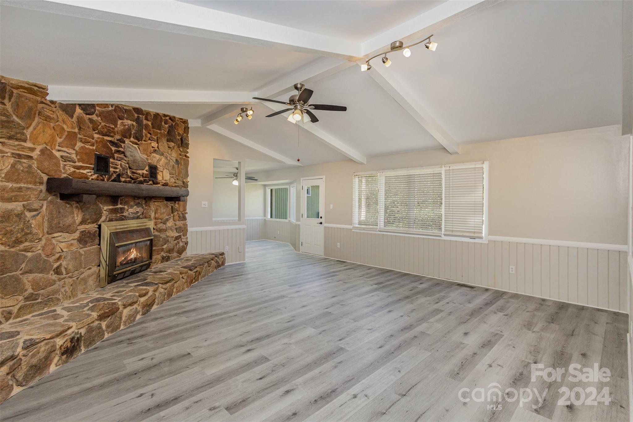1704 Double Oaks Road Fort Mill, SC 29715 - Photo 8 of 48 wooden floor in an empty room with a fireplace