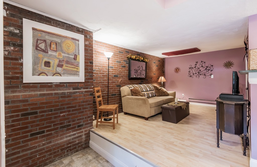 151 Killam Hill Road Boxford, MA 01921 - Photo 20 of 30 a living room with furniture and wall paintings