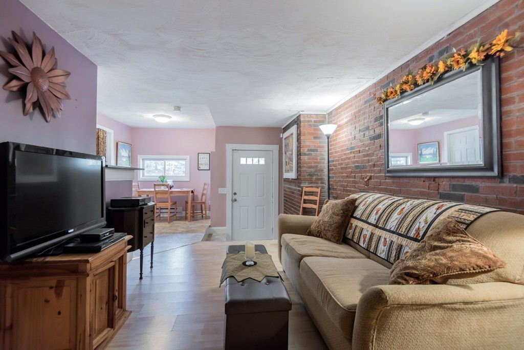 151 Killam Hill Road Boxford, MA 01921 - Photo 21 of 30 a living room with furniture and a flat screen tv