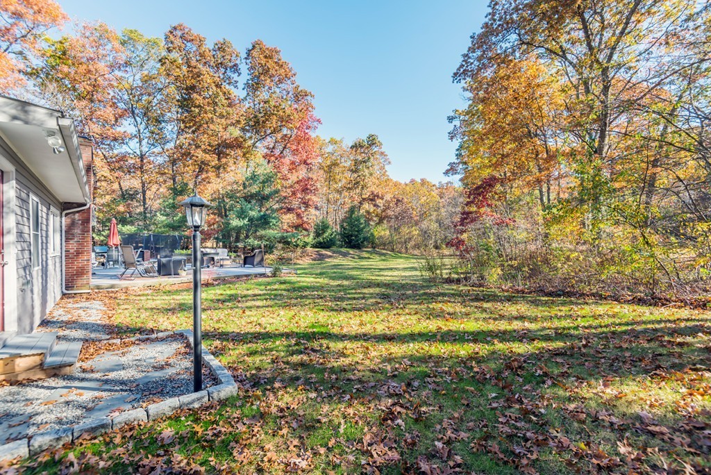 151 Killam Hill Road Boxford, MA 01921 - Photo 29 of 30 a view of a yard with a tree