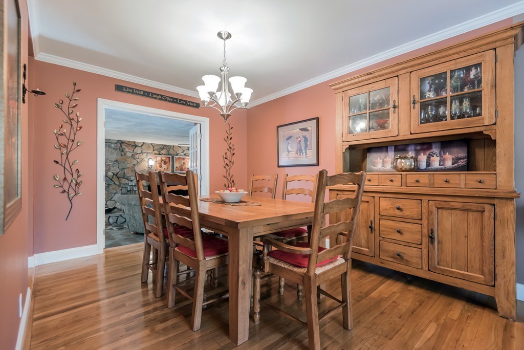 151 Killam Hill Road Boxford, MA 01921 - Photo 4 of 30 a view of a dining room with furniture wooden floor and chandelier
