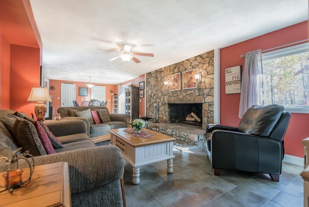 151 Killam Hill Road Boxford, MA 01921 - Photo 8 of 30 a living room with furniture and a fireplace
