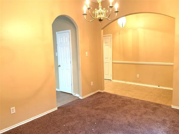 an empty room with a mirror