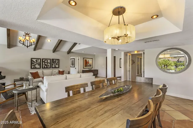 a view of a livingroom with furniture and a window