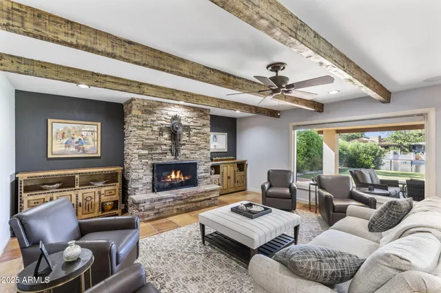 a bedroom with two beds and a large mirror