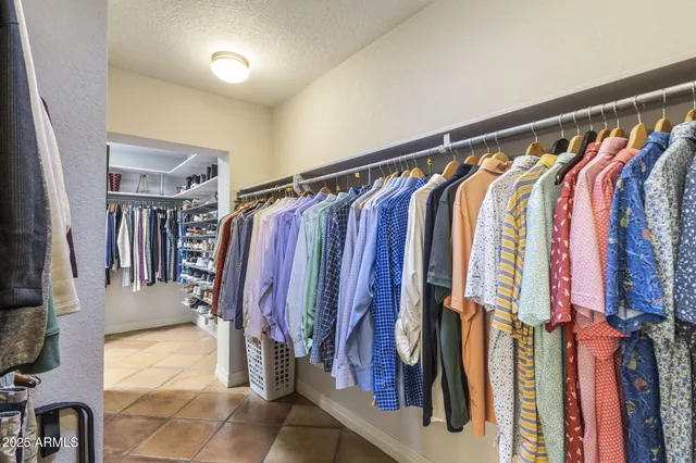 a view of an outdoor sitting area with furniture and umbrella