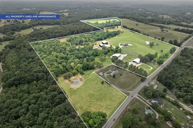 a front view of a house with a garden and plants