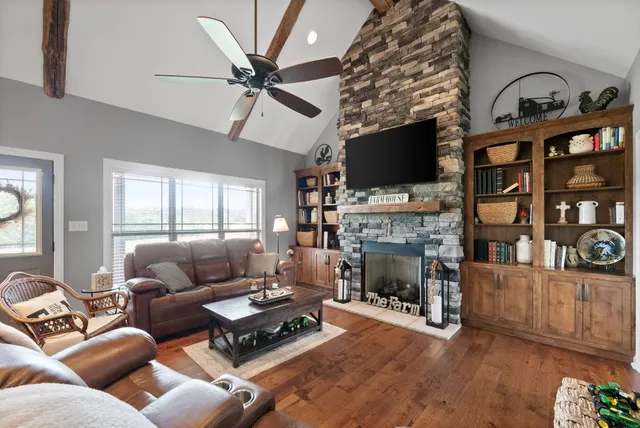 a kitchen with stainless steel appliances granite countertop a stove a sink dishwasher a refrigerator and a microwave oven