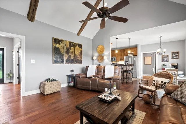 a kitchen with granite countertop stainless steel appliances a sink and a window