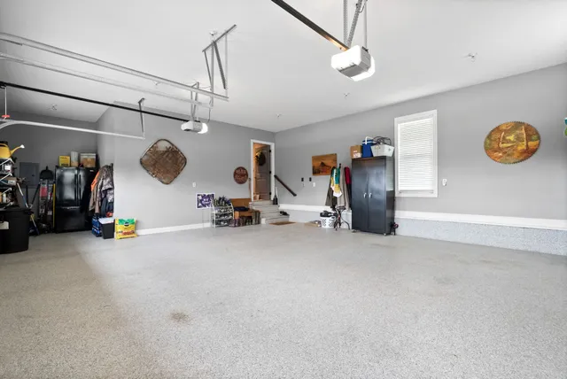 a bathroom with a granite countertop toilet sink and mirror
