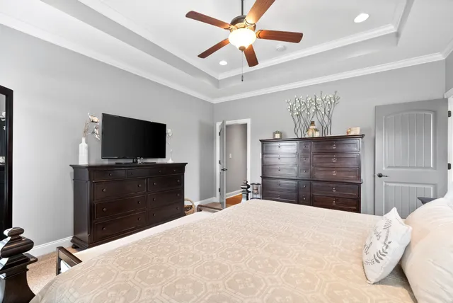 a bedroom with a bed and a book shelf