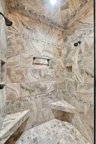 a bathroom with a toilet a sink and a mirror