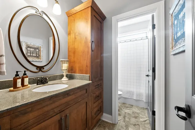 an aerial view of a house with a yard table and chairs