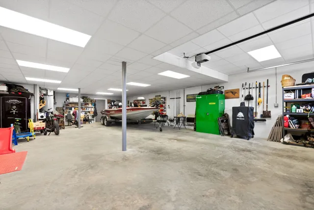 an aerial view of lake residential houses with outdoor space and ocean view