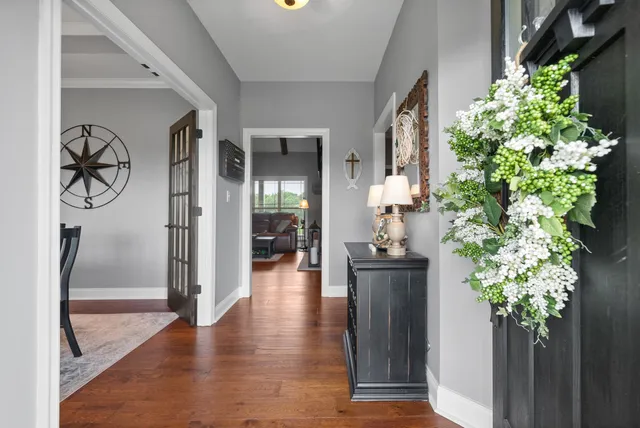 a living room with fireplace furniture and a book shelf