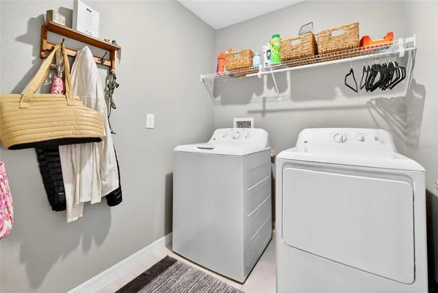 a bed room with a bed and a ceiling fan