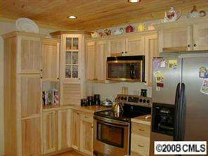 280 Williamsburg Road Olin, NC 28660 - Photo 3 of 8 a kitchen with stainless steel appliances a refrigerator stove and sink