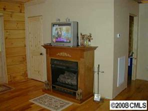 280 Williamsburg Road Olin, NC 28660 - Photo 6 of 8 a living room with a fireplace