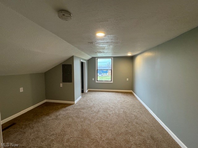 10264 Tallmadge Road Diamond, OH 44412 - Photo 23 of 32 Bonus room featuring light colored carpet and a textured ceiling