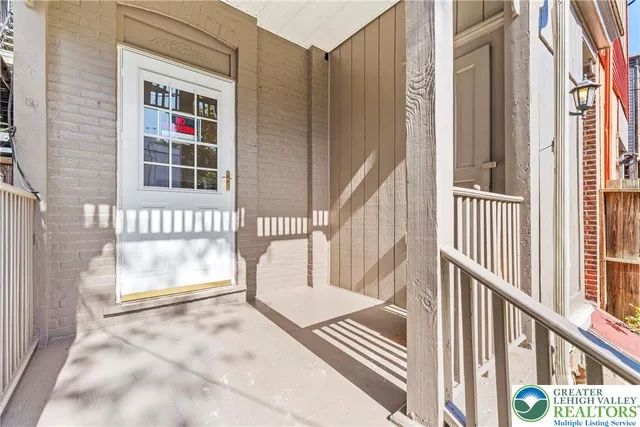 a view of empty room with wooden walls