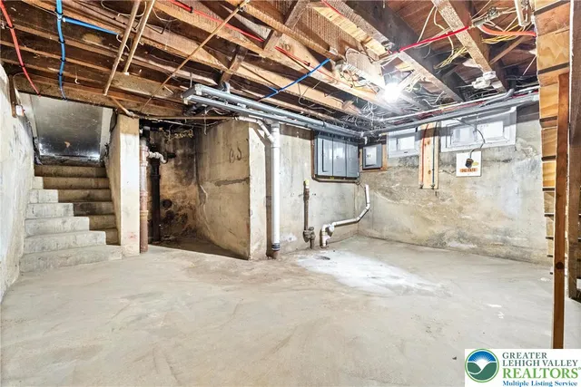 a aerial view of a residential apartment building with a yard and potted plants