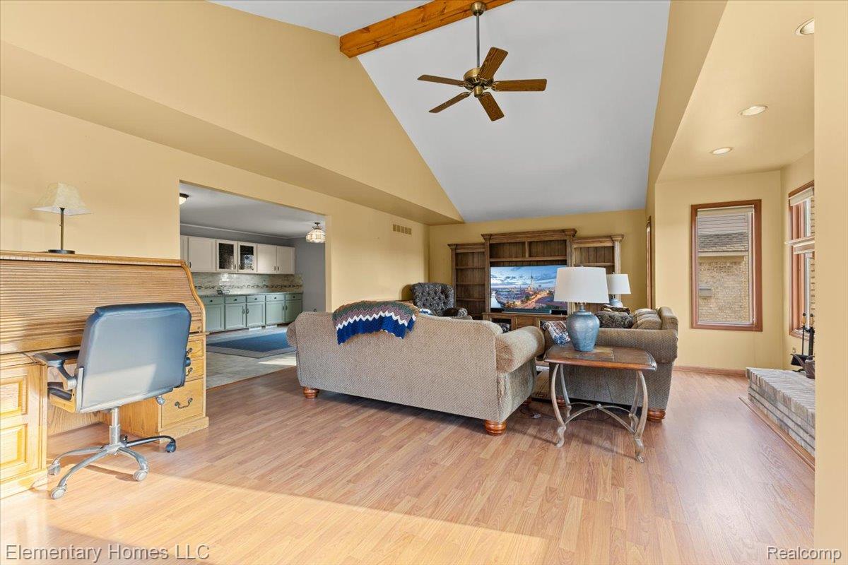 51637 Baker Road New Baltimore, MI 48047 - Photo 24 of 47 Living room with ceiling fan, light wood-style flooring, and an office area