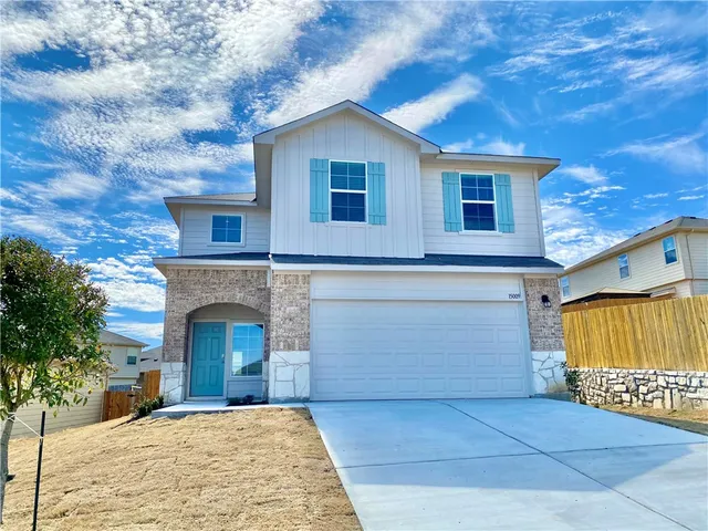 a view of a house with a garage