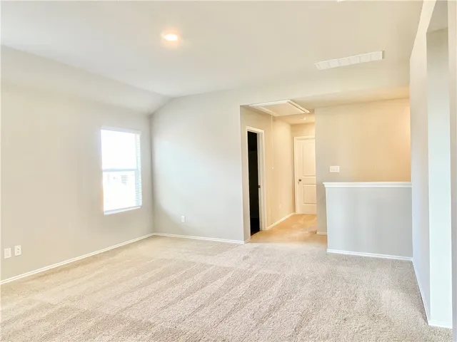 a view of a small space with wooden floor