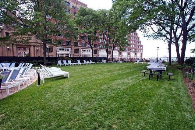 a view of a house with a yard porch and sitting area