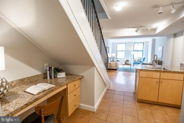 616 E Street Northwest, Unit 655 Washington, DC 20004 - Photo 2 of 38 a kitchen with sink refrigerator and microwave