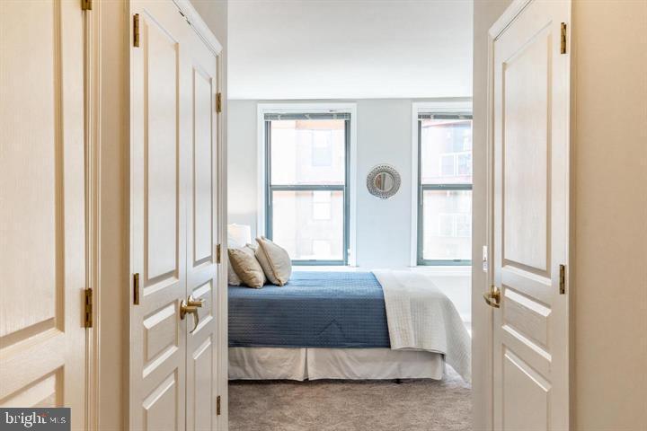 616 E Street Northwest, Unit 655 Washington, DC 20004 - Photo 16 of 38 a living room with furniture and a large window